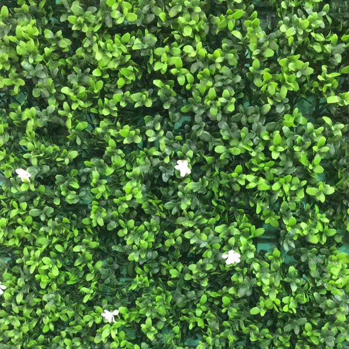 Blossoming summer artificial green wall